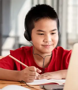 young asian boy smiling at school